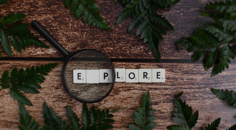 Explore spelled in scrabble tiles