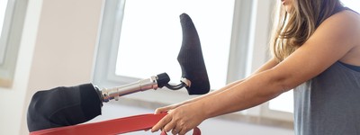 Person exercising with a prosthetic leg