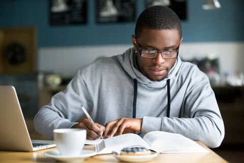 Veteran student working at his desk.